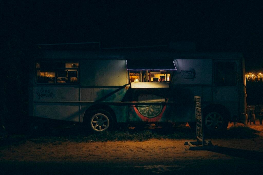 A vibrant food truck operating at night in Galle, Sri Lanka, offering street food vibes.